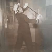 Elnorah with suit and cane.jpg