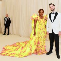 Serena Williams in Versace posing with husband