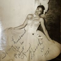 Elnorah with fancy dress autographed to husband.jpg